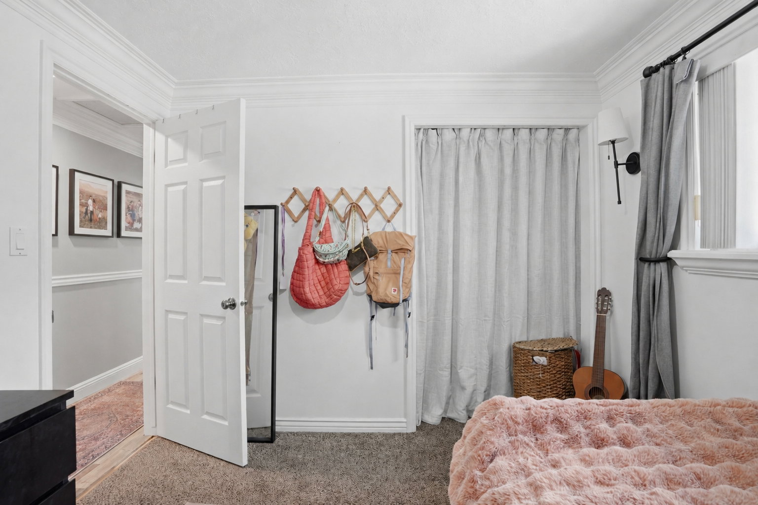 Interior room featuring light gray walls, white crown molding, and white baseboards