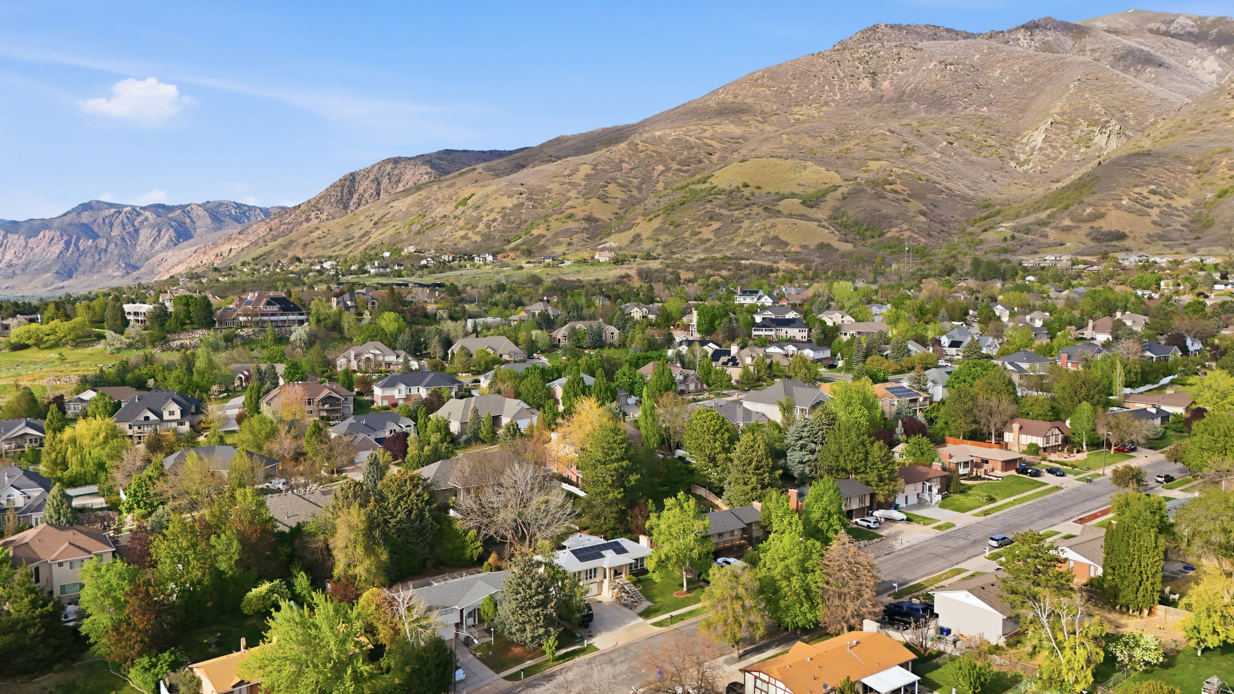 Aerial view of residential area with mountains