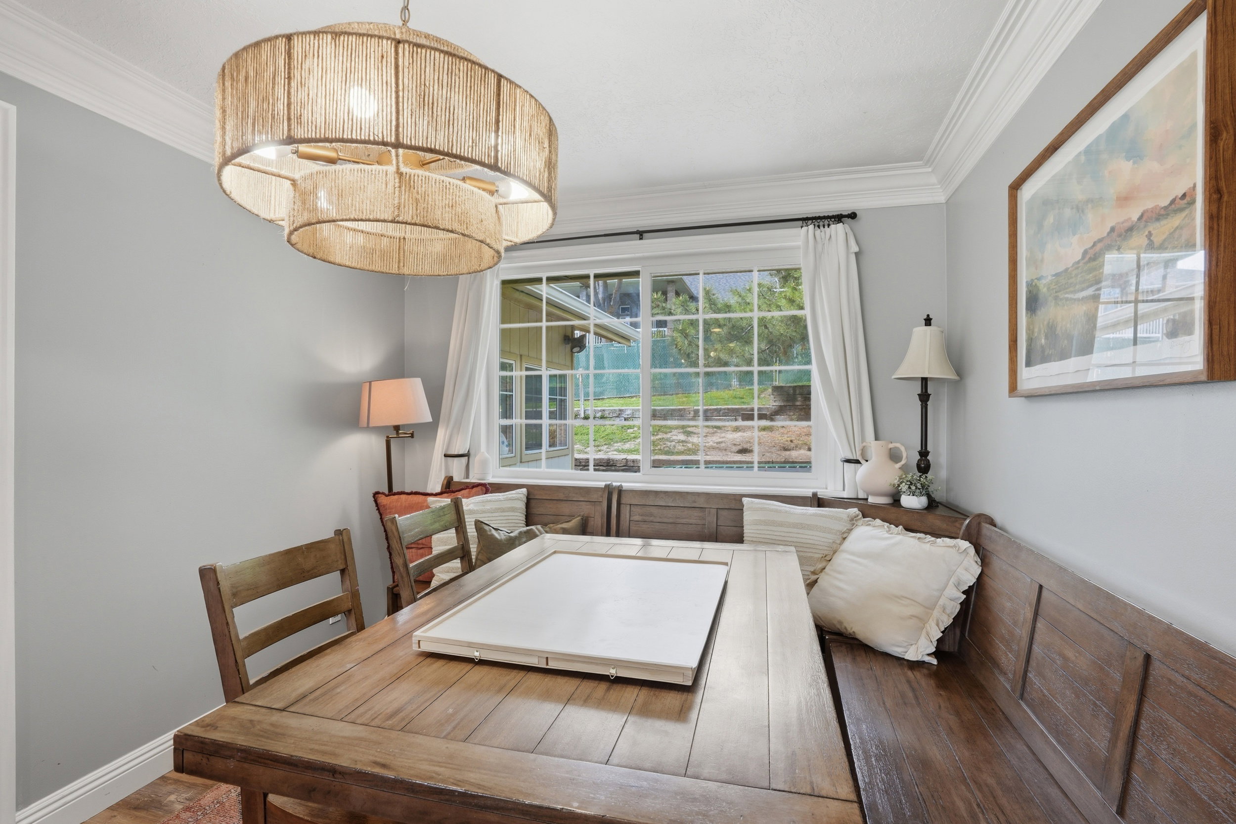 Dining area featuring ornamental molding, a chandelier, and dark wood-type flooring