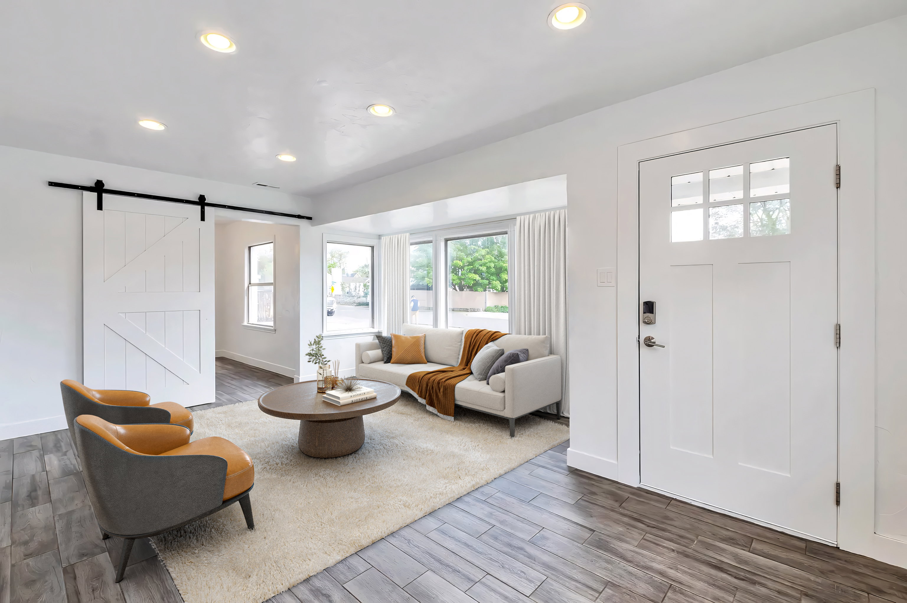 Foyer entrance featuring a barn door, wood finished floors, and recessed lighting