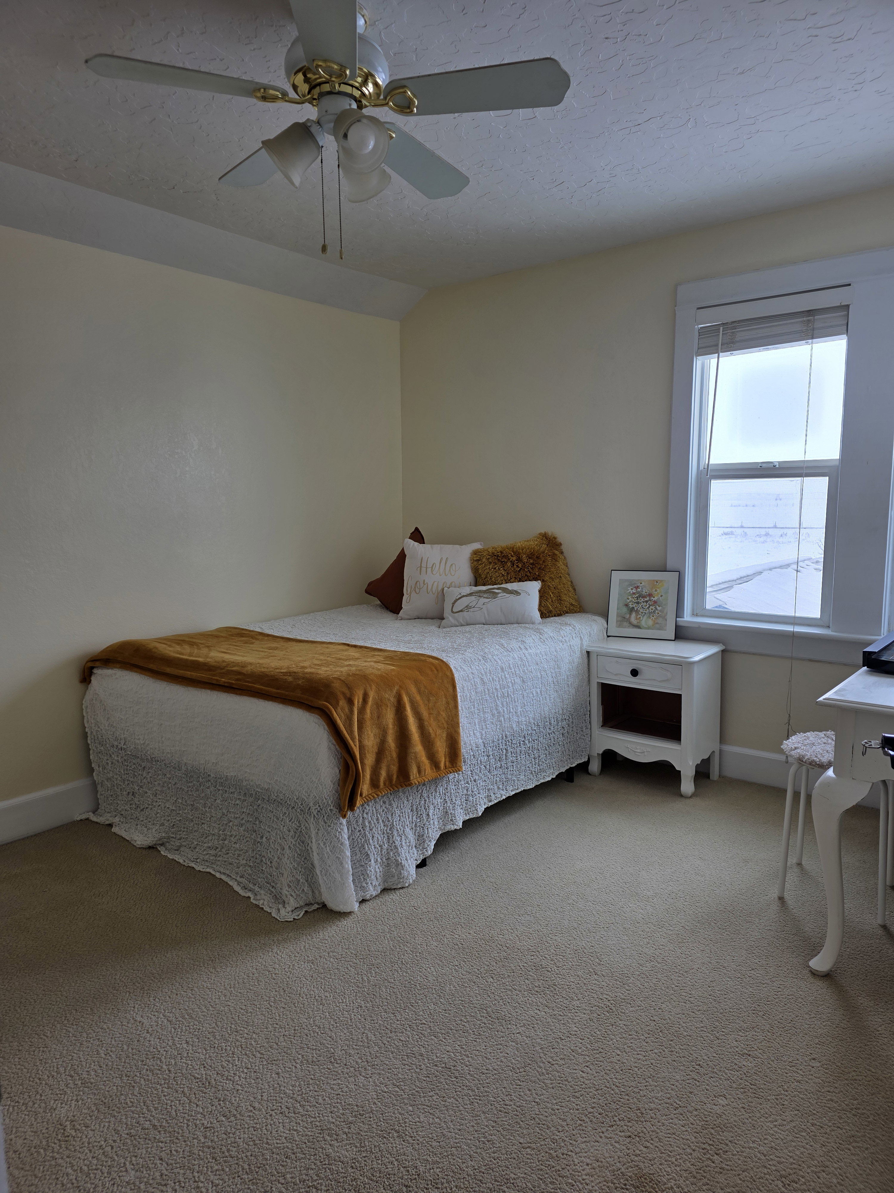 Carpeted bedroom with baseboards and ceiling fan
