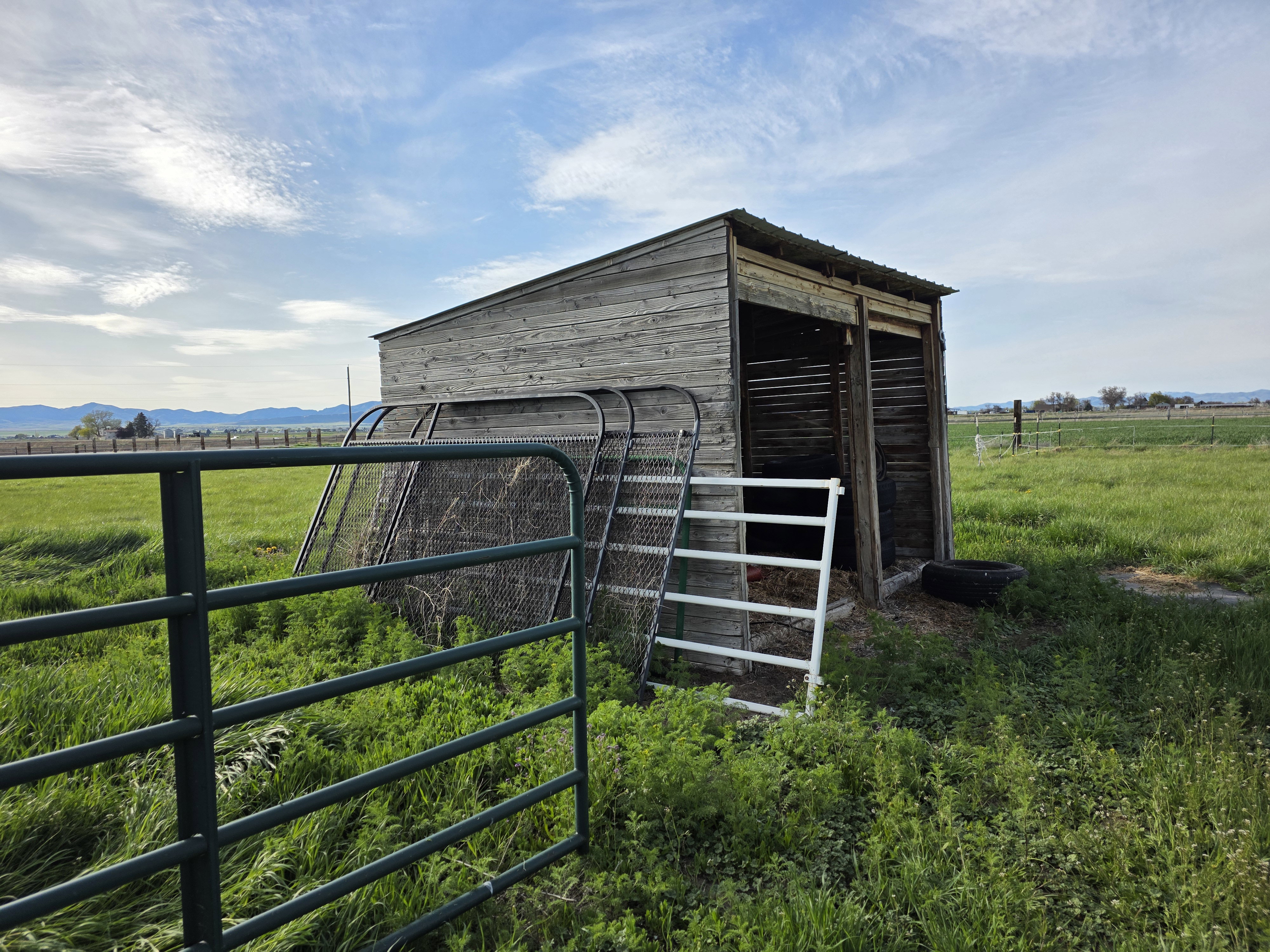 View of outbuilding featuring a view of rural / pastoral area, an exterior structure, and a mountain view