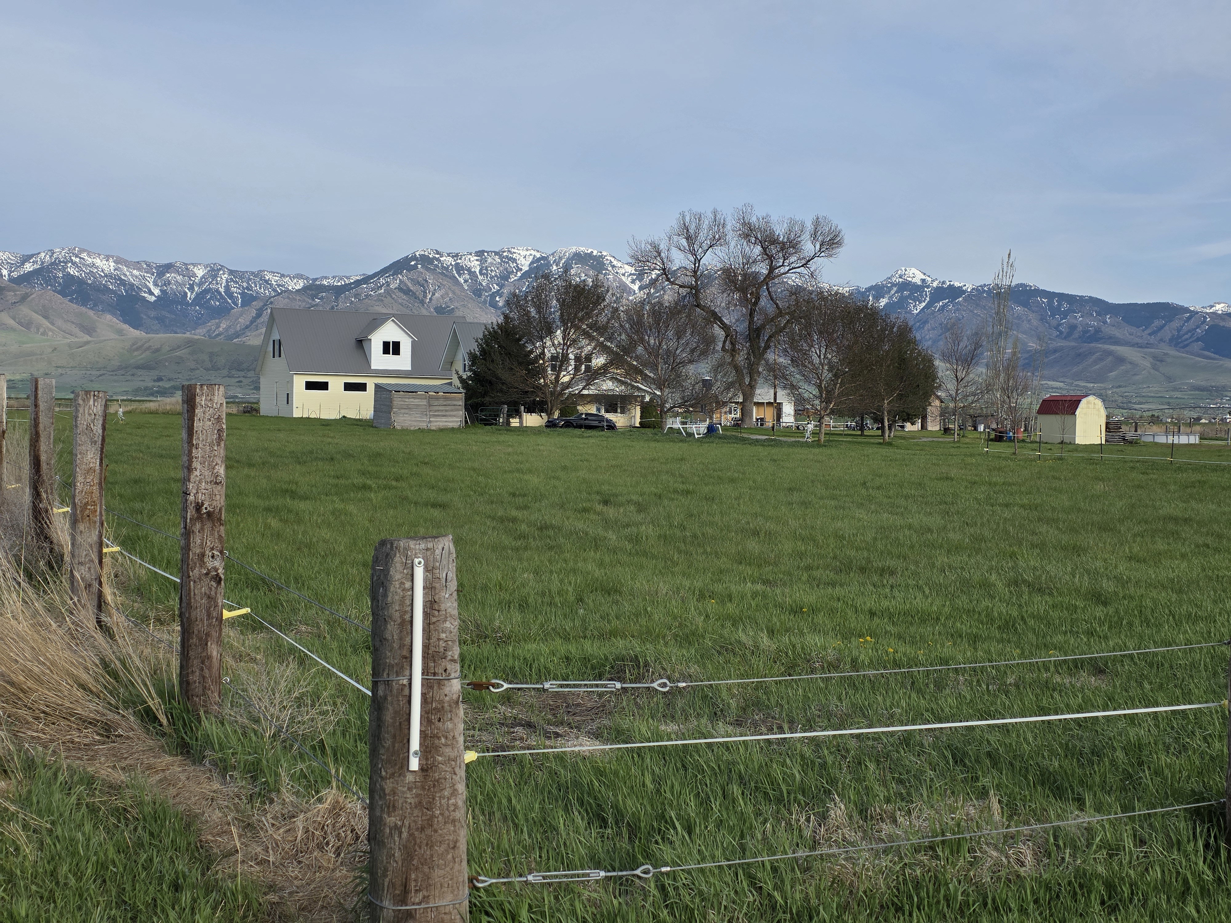 View of yard featuring a mountain view, a view of rural / pastoral area, and an outdoor structure