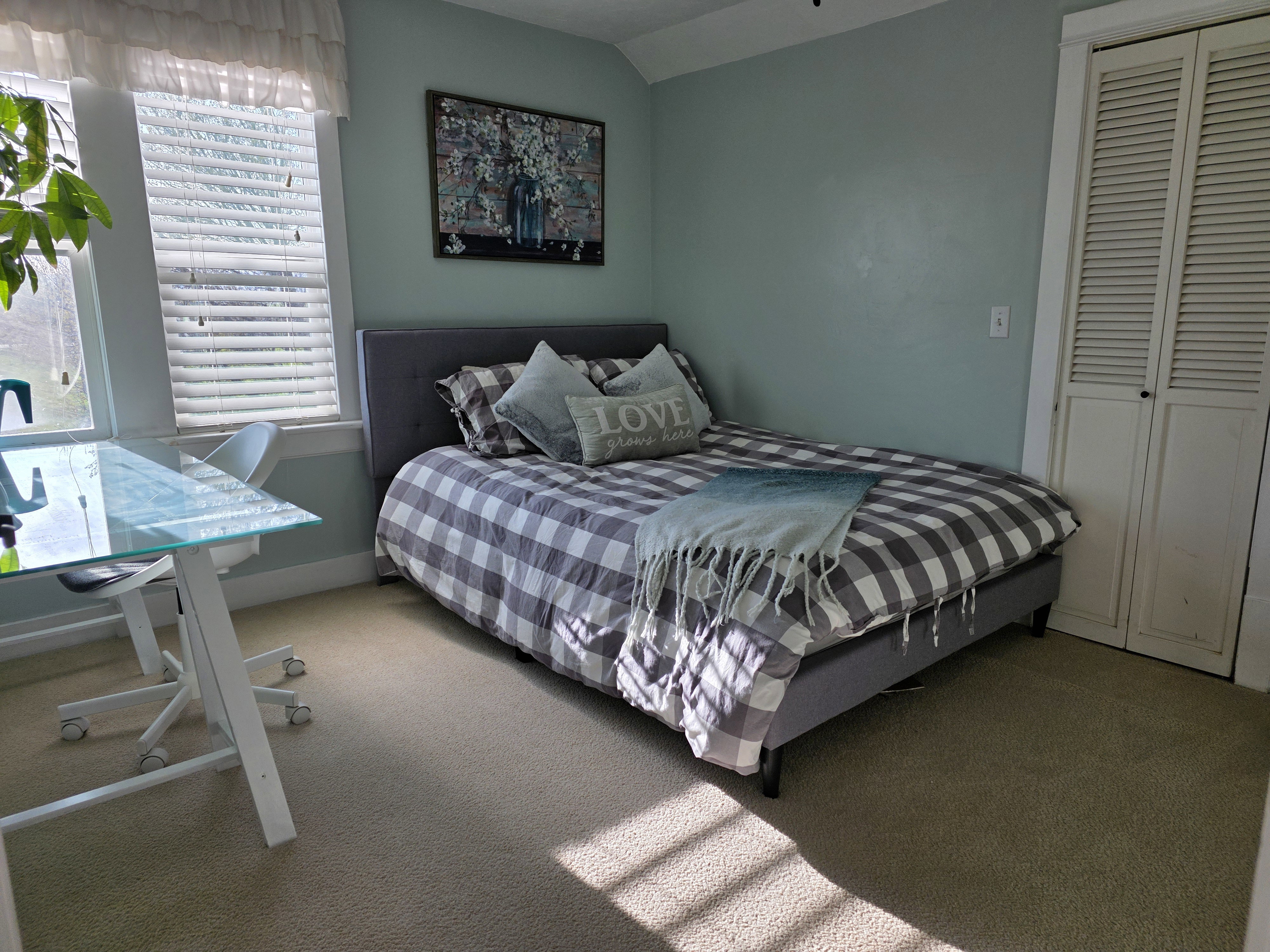 Bedroom featuring carpet floors, a closet, and vaulted ceiling