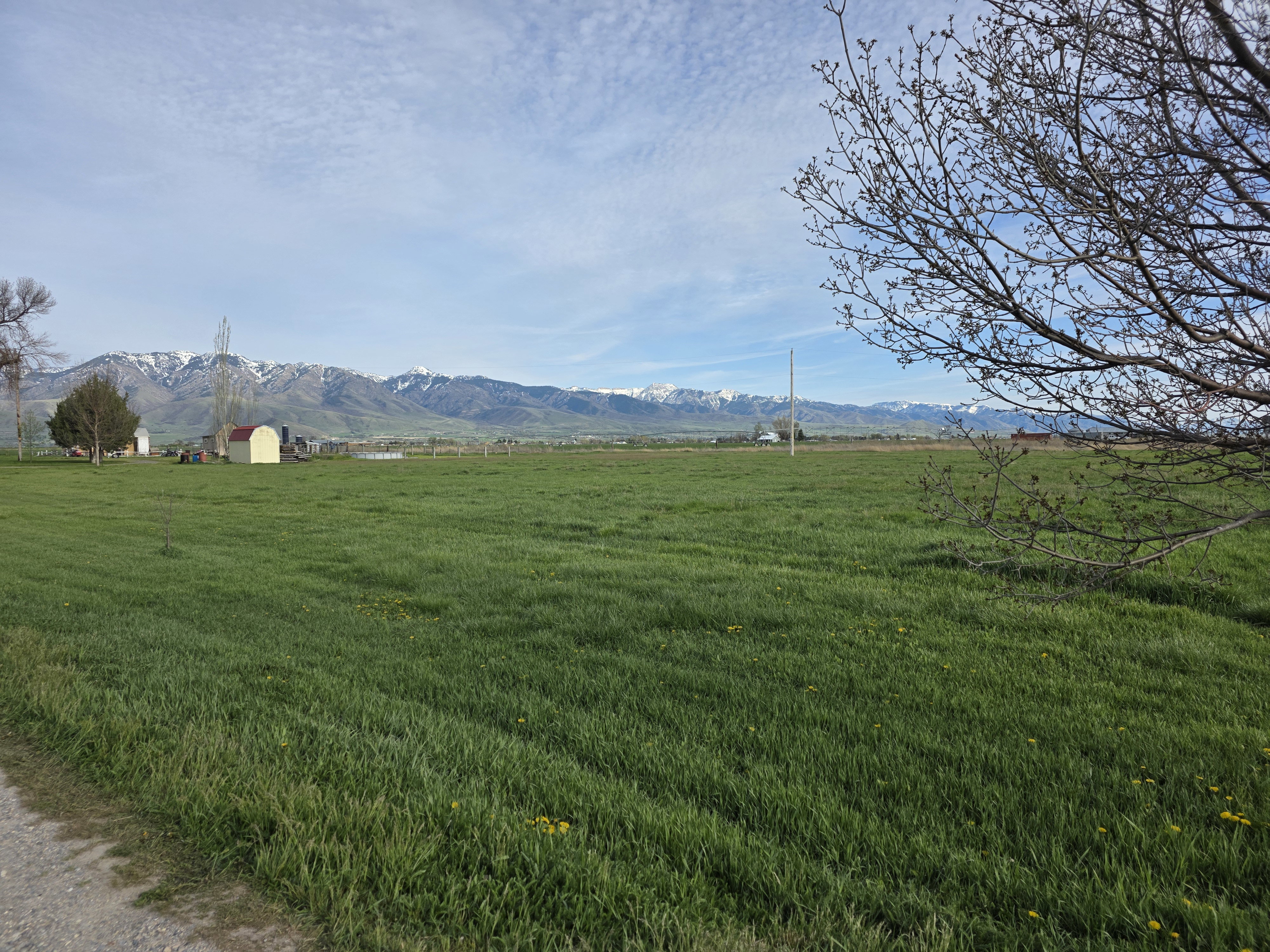 View of mountain backdrop featuring rural landscape