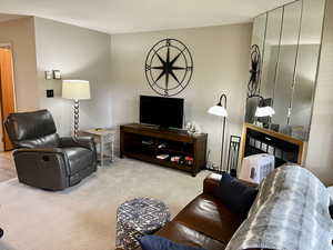 Living room with carpet.  Fully Furnished.