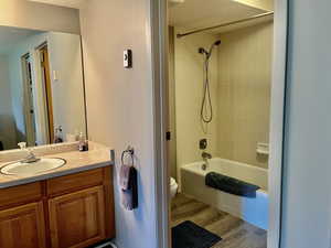 Full Bathroom with large mirror and vanity.