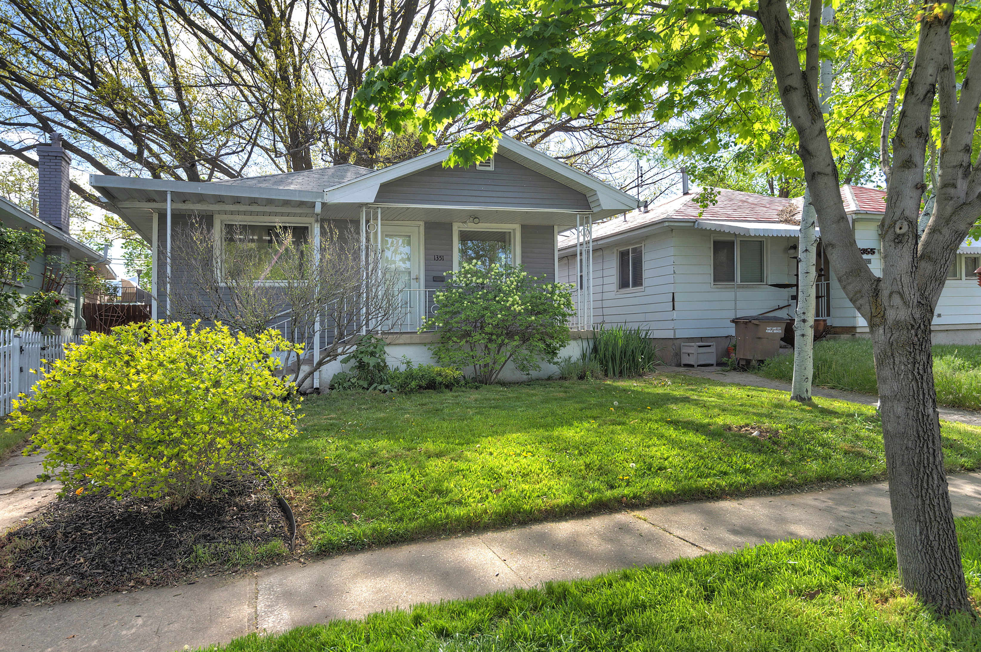 Bungalow-style house with a front yard and a porch