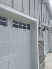 White paneled garage doors with upper window inserts