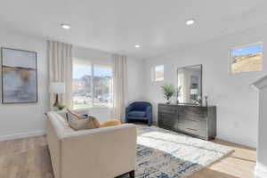 Sitting room featuring light wood-style flooring and recessed lighting