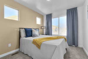 Bedroom with light carpet
