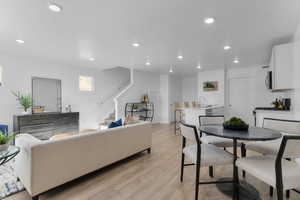 Dining space featuring light wood-style flooring and recessed lighting
