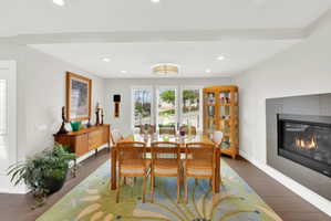 Dining room featuring tile flooring, a fireplace, and recessed lighting