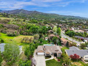 Aerial view of residential area featuring a mountain backdrop