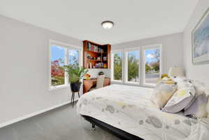 Carpeted bedroom with baseboards