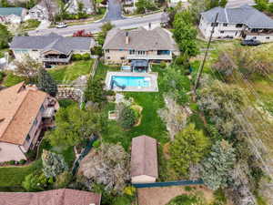 Aerial perspective of suburban area featuring a pool