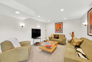 Living room featuring carpet flooring and recessed lighting