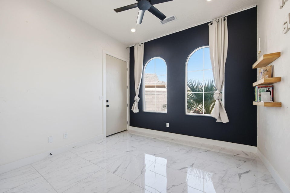 Unfurnished room with ceiling fan, light marble finish floors, and recessed lighting