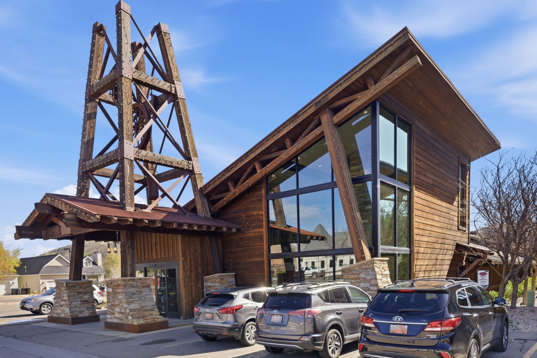 View of building exterior featuring uncovered parking