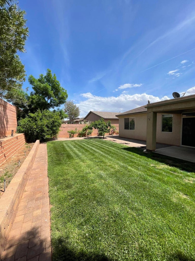 Fenced backyard featuring a patio area