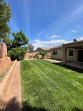 Fenced backyard featuring a patio area