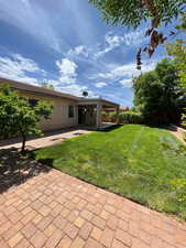 Fenced yard featuring a patio