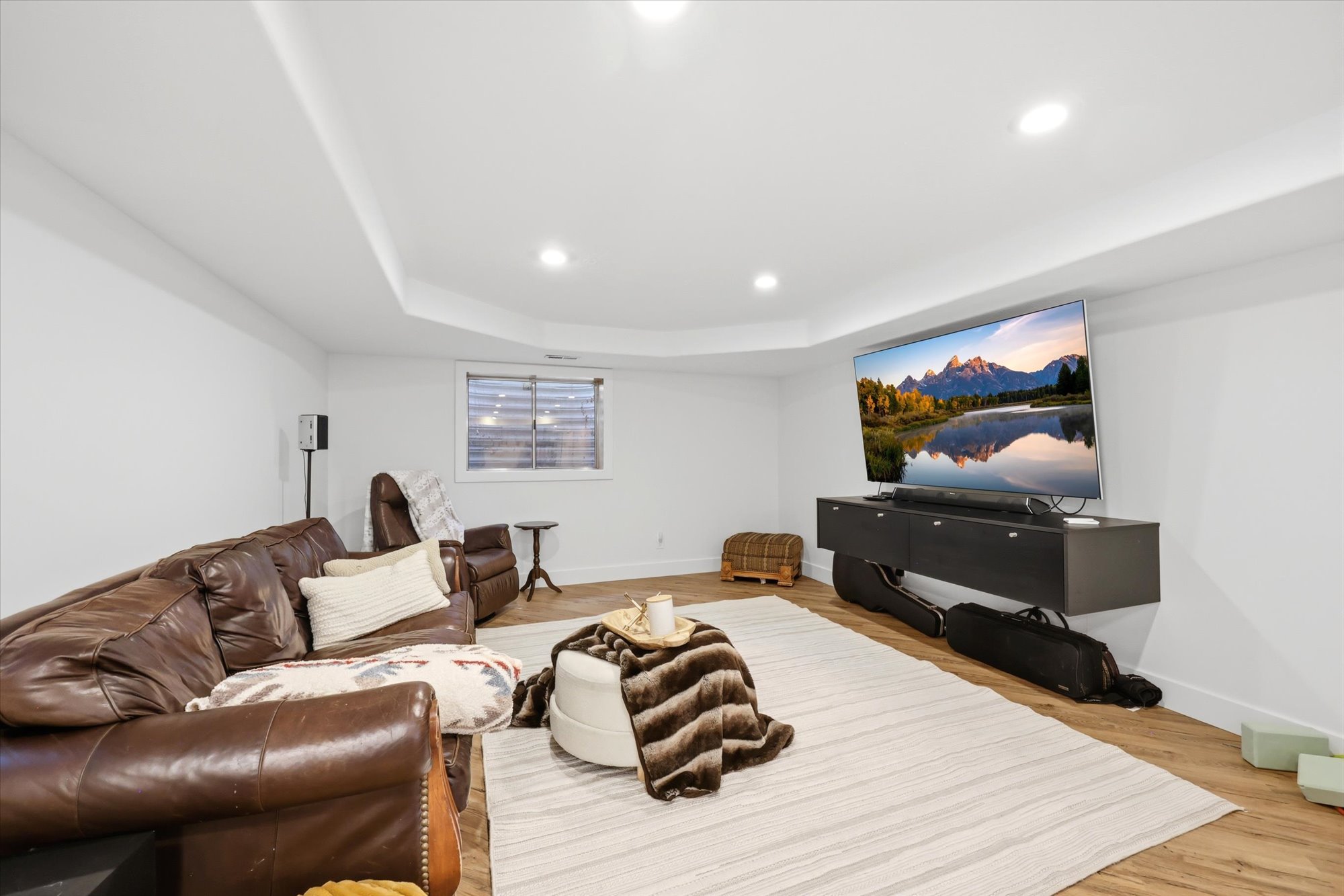 Living area with recessed lighting and light wood-style floors