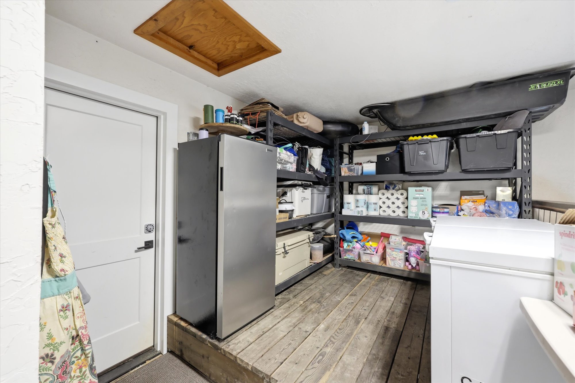 Kitchen featuring freestanding refrigerator and light wood finished floors