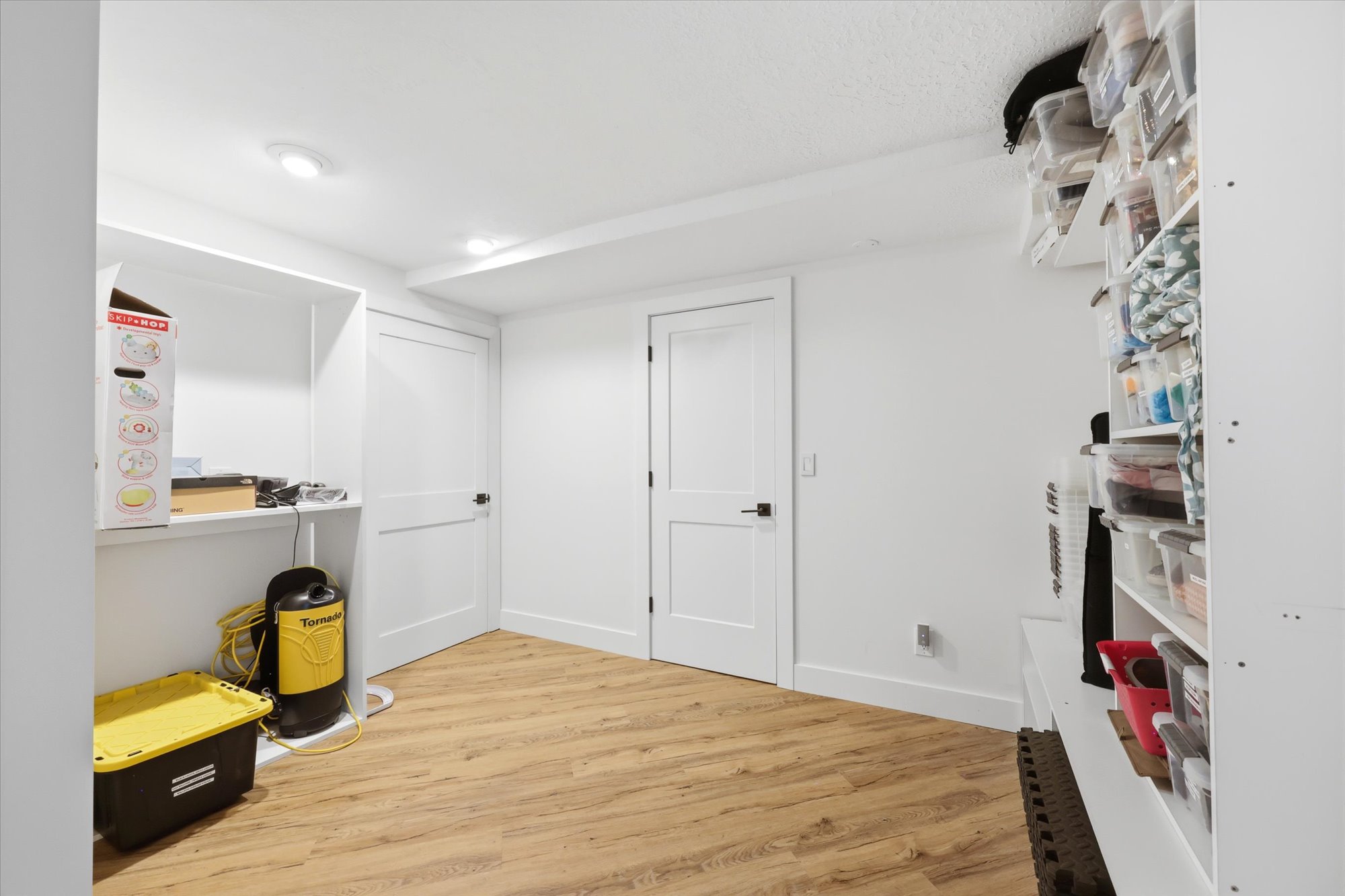 Walk in closet featuring light wood-style flooring