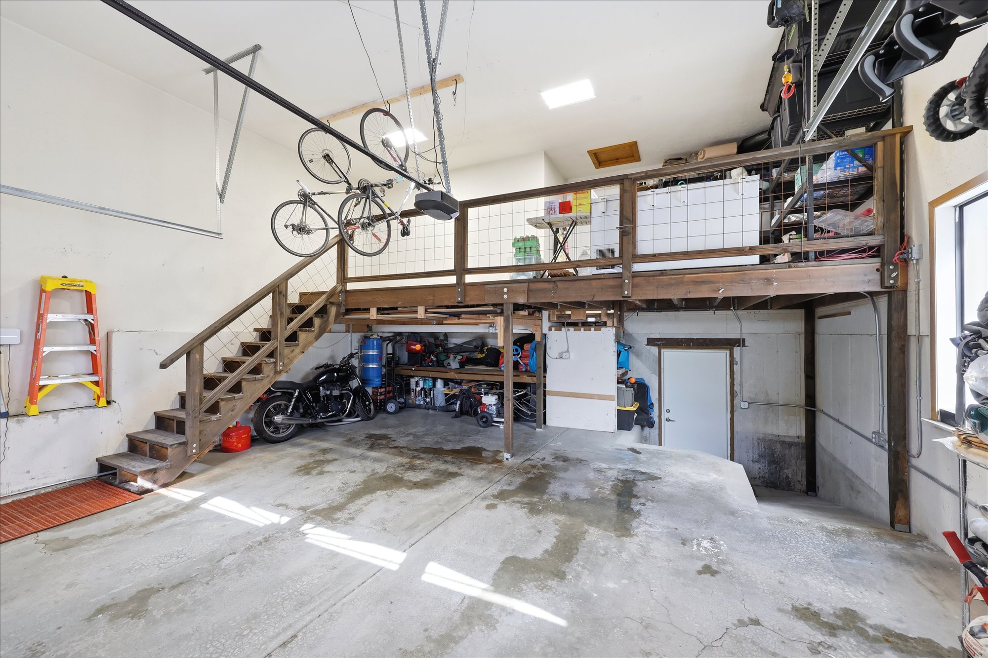 Garage featuring a garage door opener