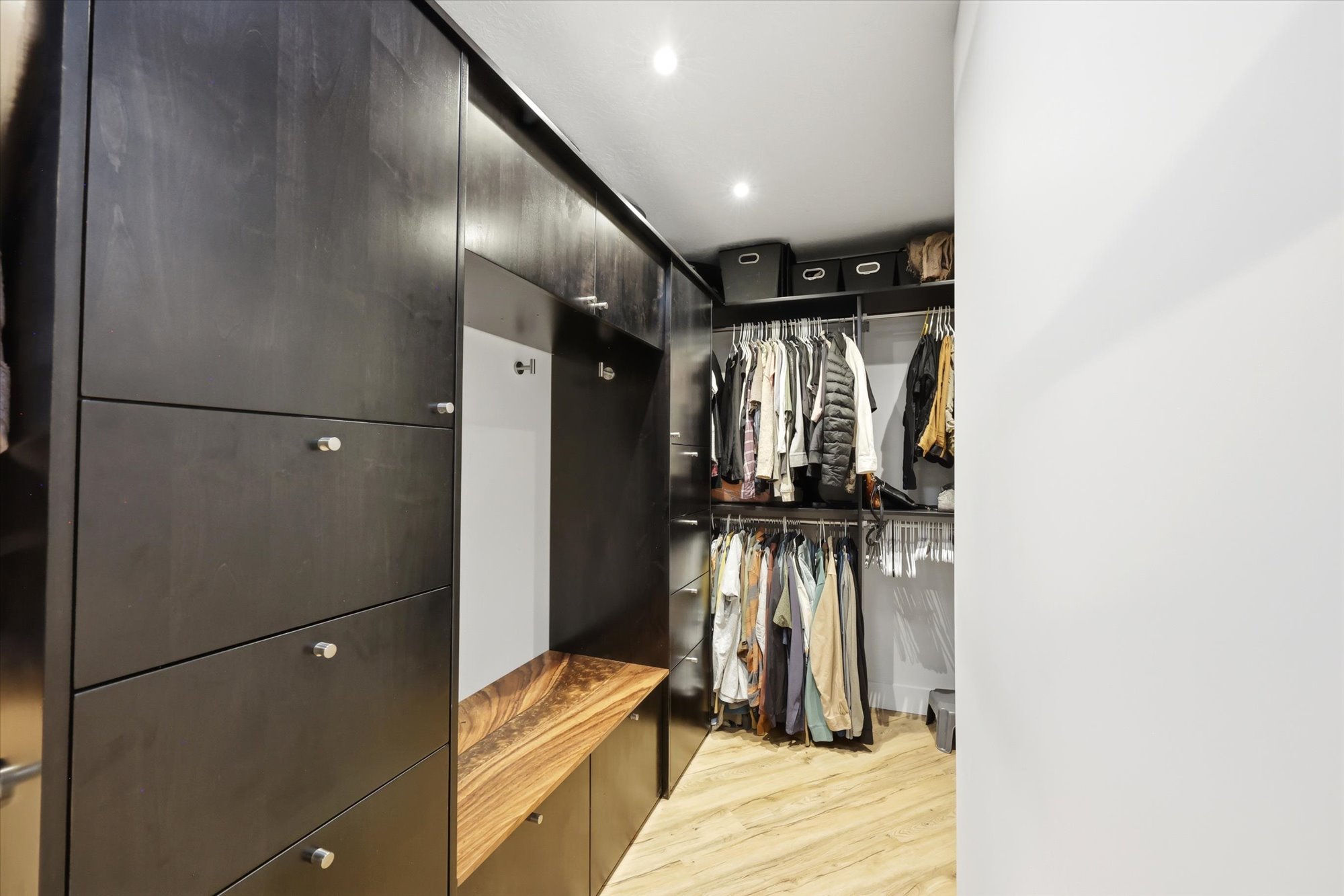 Walk in closet featuring light wood-style flooring