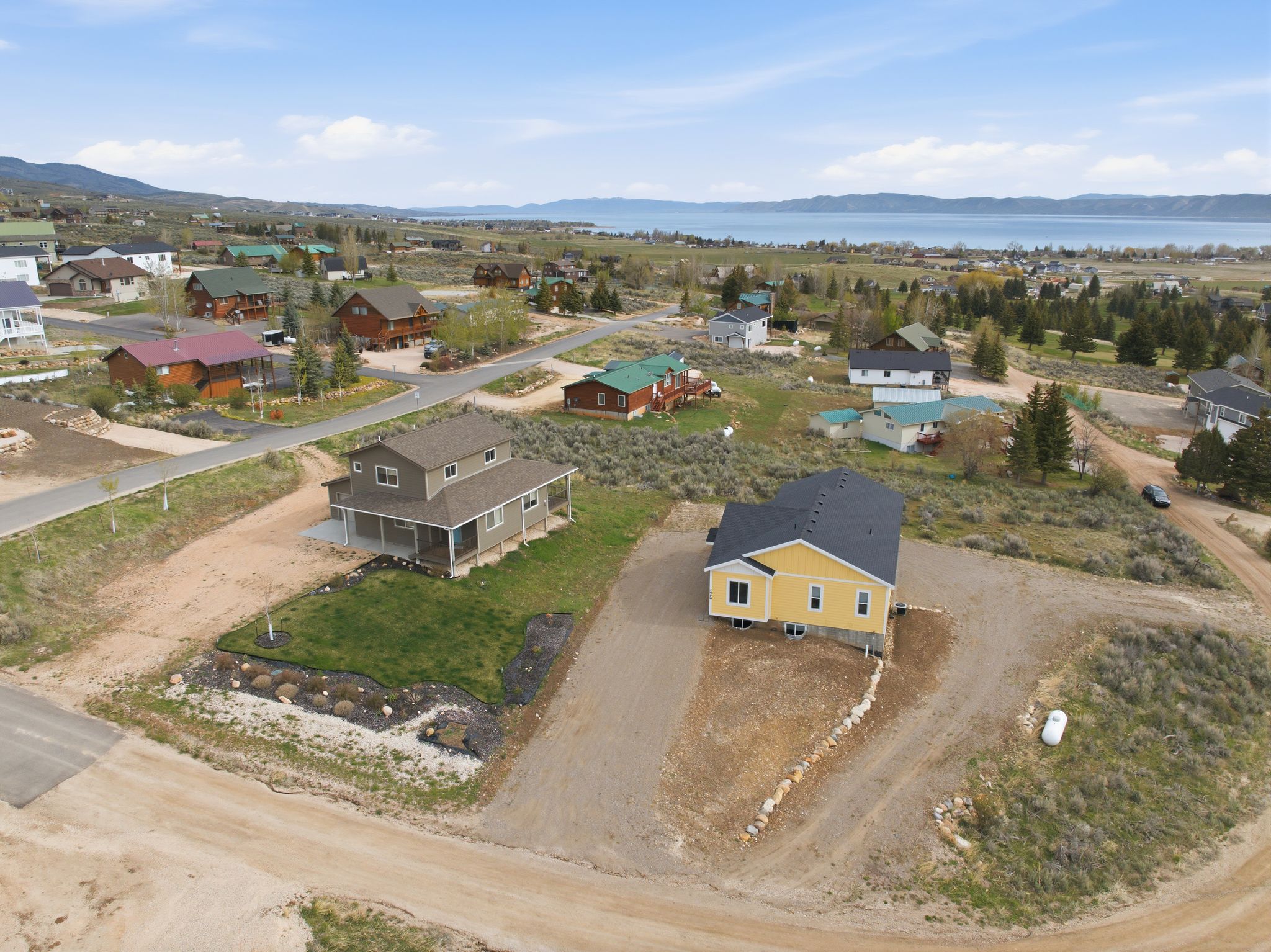 Aerial view of property's location featuring mountains and nearby suburban area