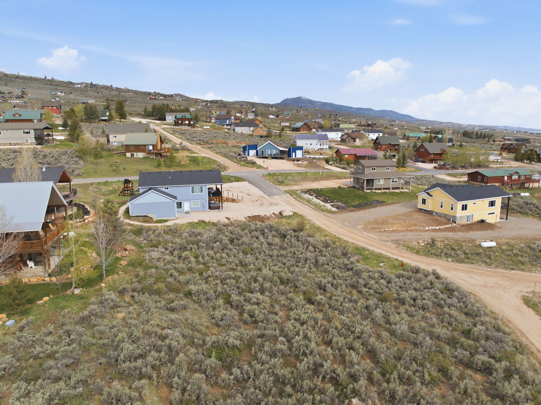 Aerial view of residential area featuring mountains