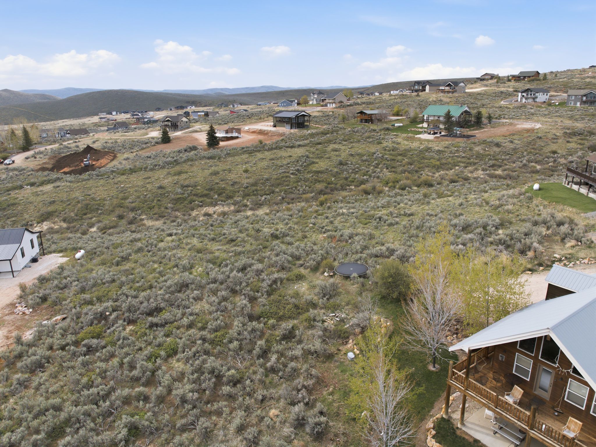 Aerial view of residential area featuring a mountainous background