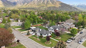 Aerial perspective of suburban area featuring a mountain backdrop