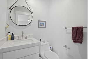 Bathroom with vanity and toilet