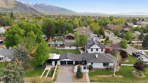 Aerial perspective of suburban area featuring a mountainous background