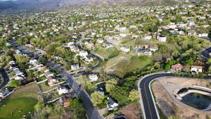 Aerial view of residential area featuring a mountainous background