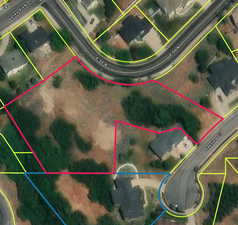 Aerial map of property and surrounding area featuring property boundaries highlighted
