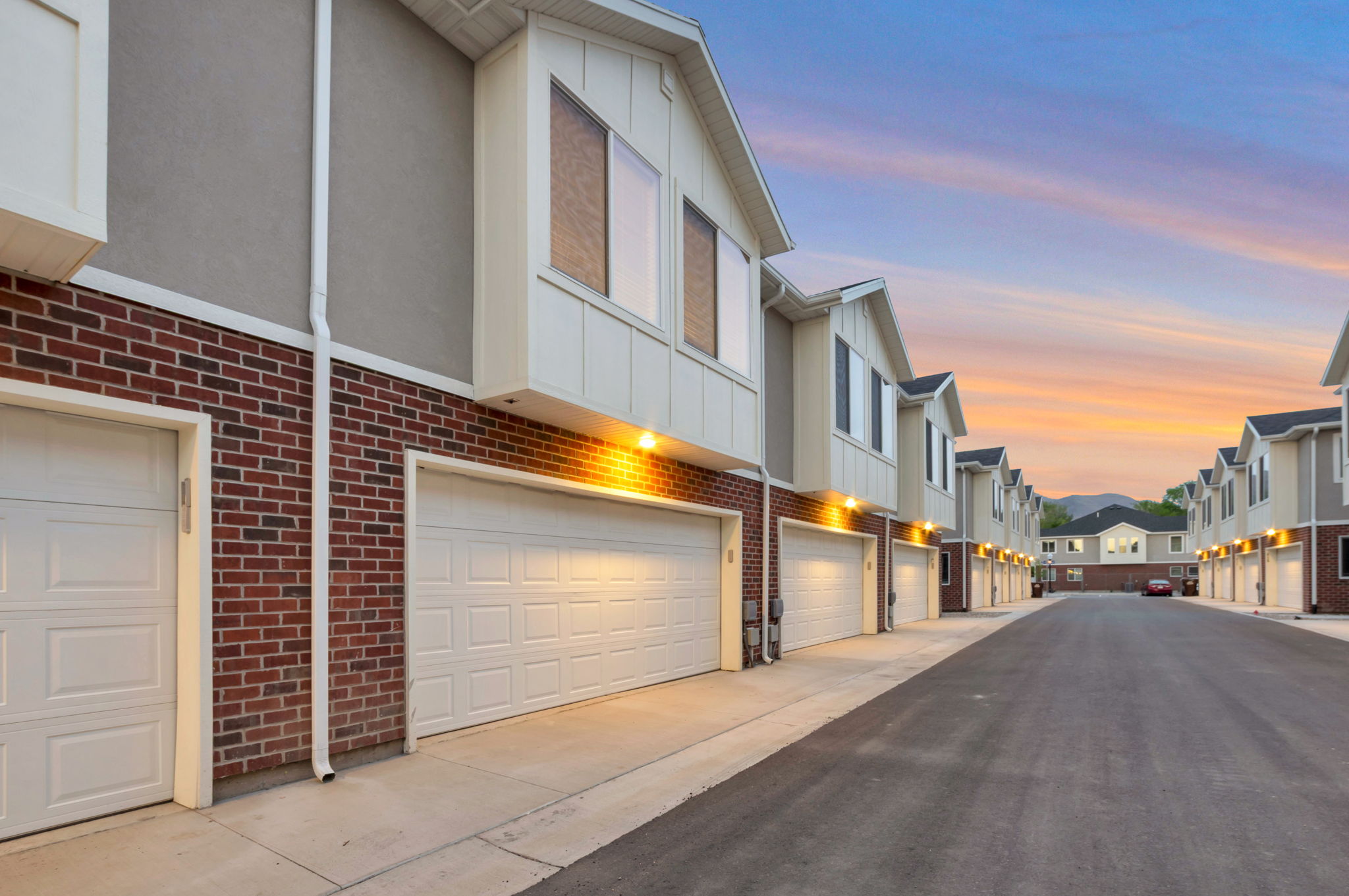 View of asphalt road featuring a residential view