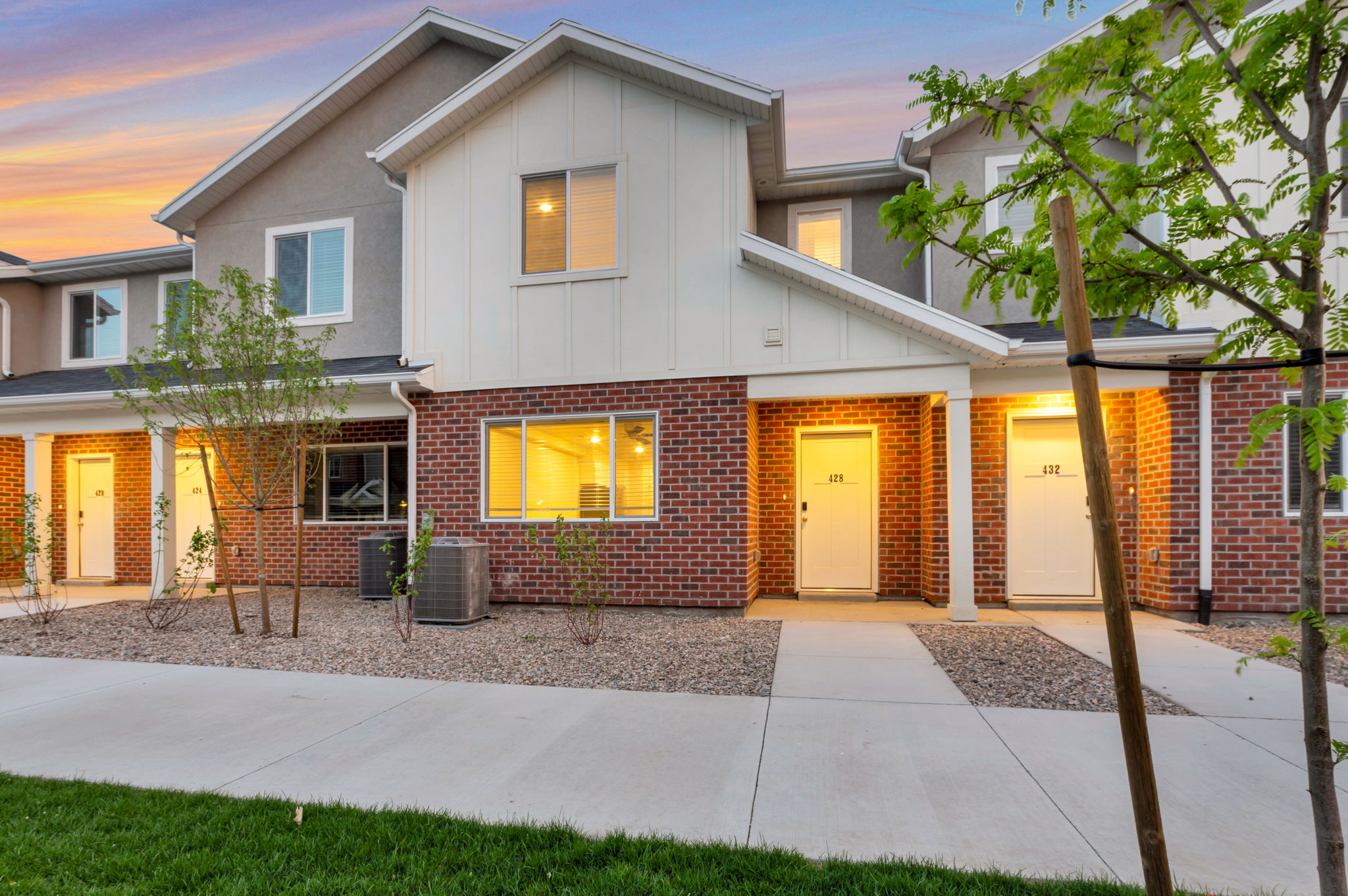 Traditional-style home with board and batten siding and brick siding