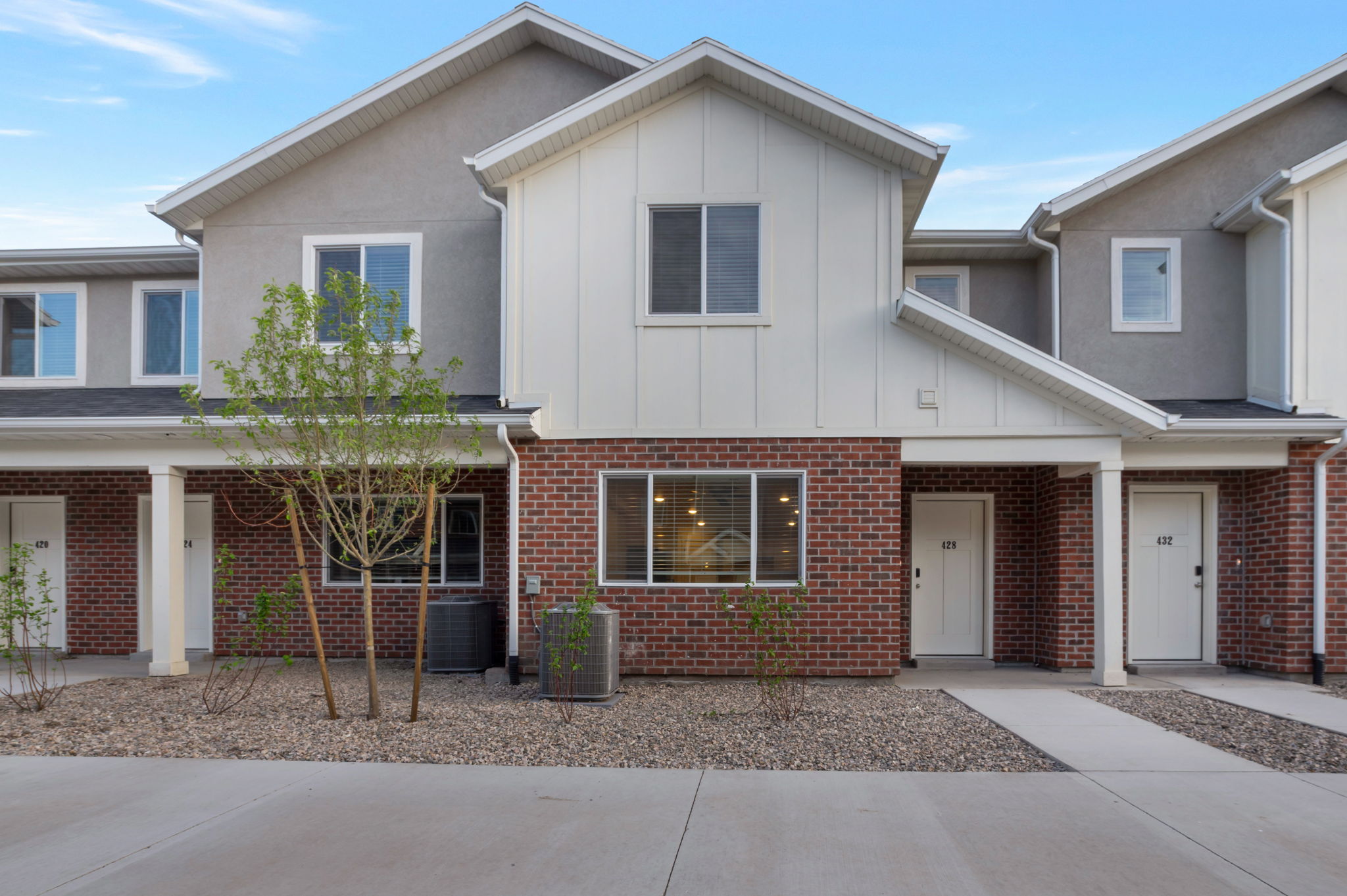 Traditional-style home featuring board and batten siding and brick siding