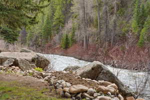View of tree filled area with a water view