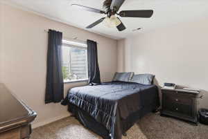 Bedroom featuring carpet and ceiling fan