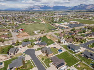 View of property location featuring nearby suburban area and a mountain backdrop