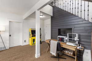 Office with baseboards and dark carpet