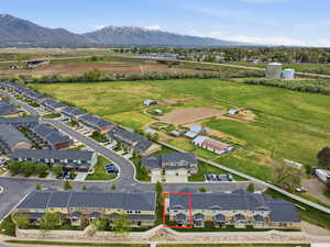 Aerial view of residential area featuring a mountain backdrop