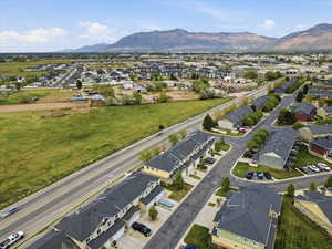 Aerial view of residential area featuring a mountainous background