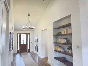 Large Foyer with Built-ins and Complimentary Lighting