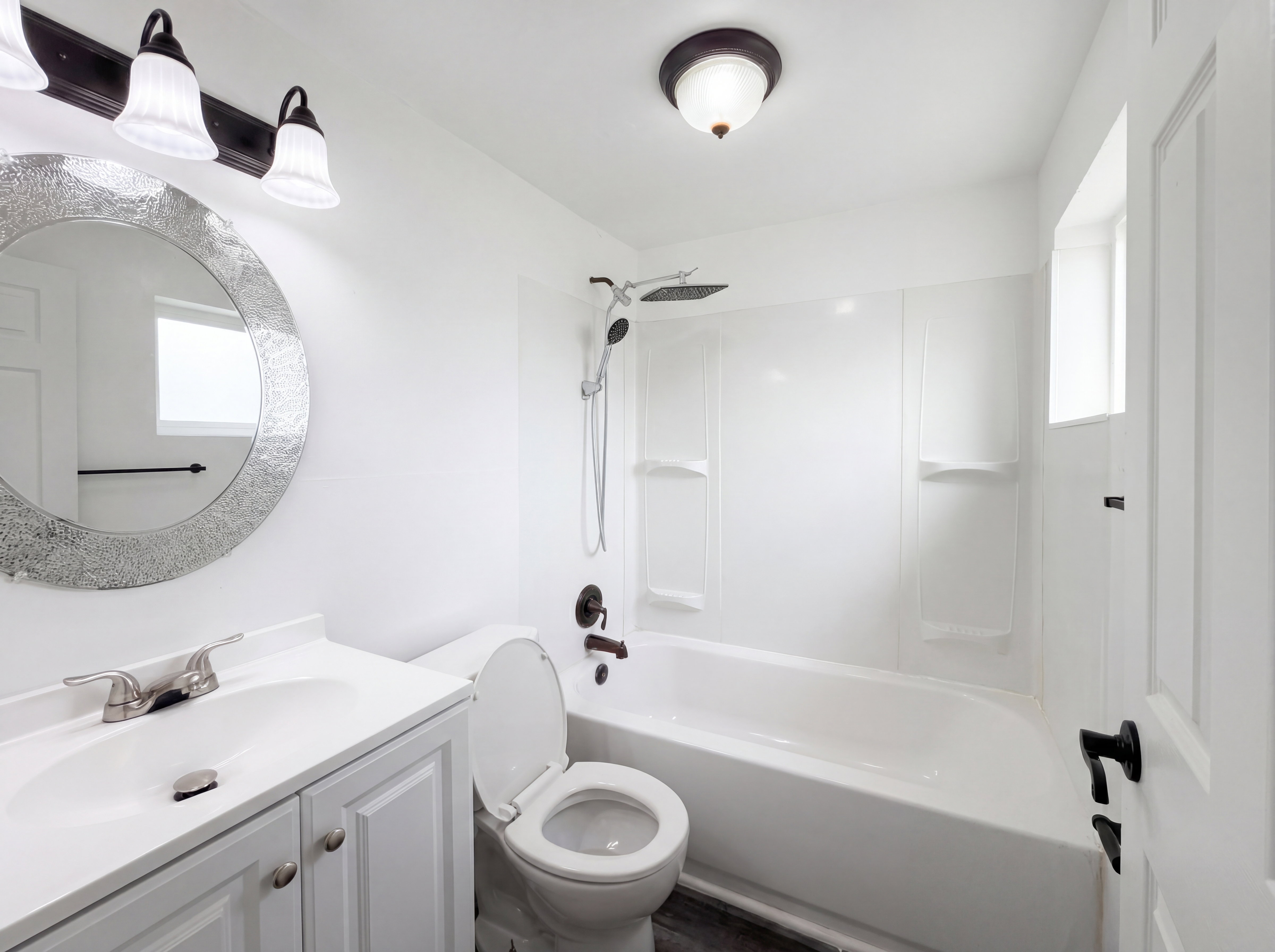 Bathroom with vanity and shower / washtub combination